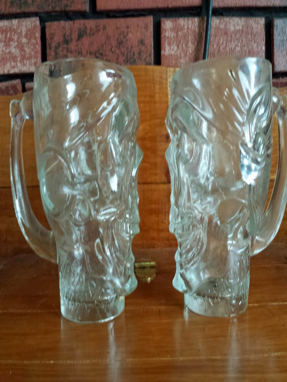 2 Treasure Island Las Vegas glass skull mugs